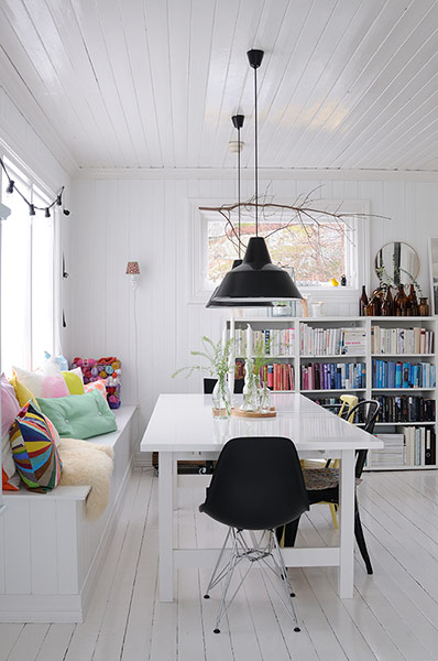 white room with black shades and black chairs